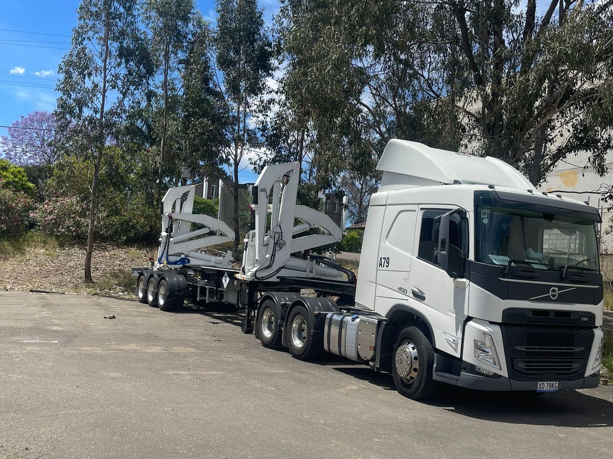 An Aardiv prime mover coupled to a side loader trailer